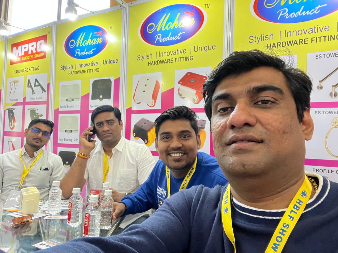 Mohan Product staff at the HBLF Show stall with product boards behind