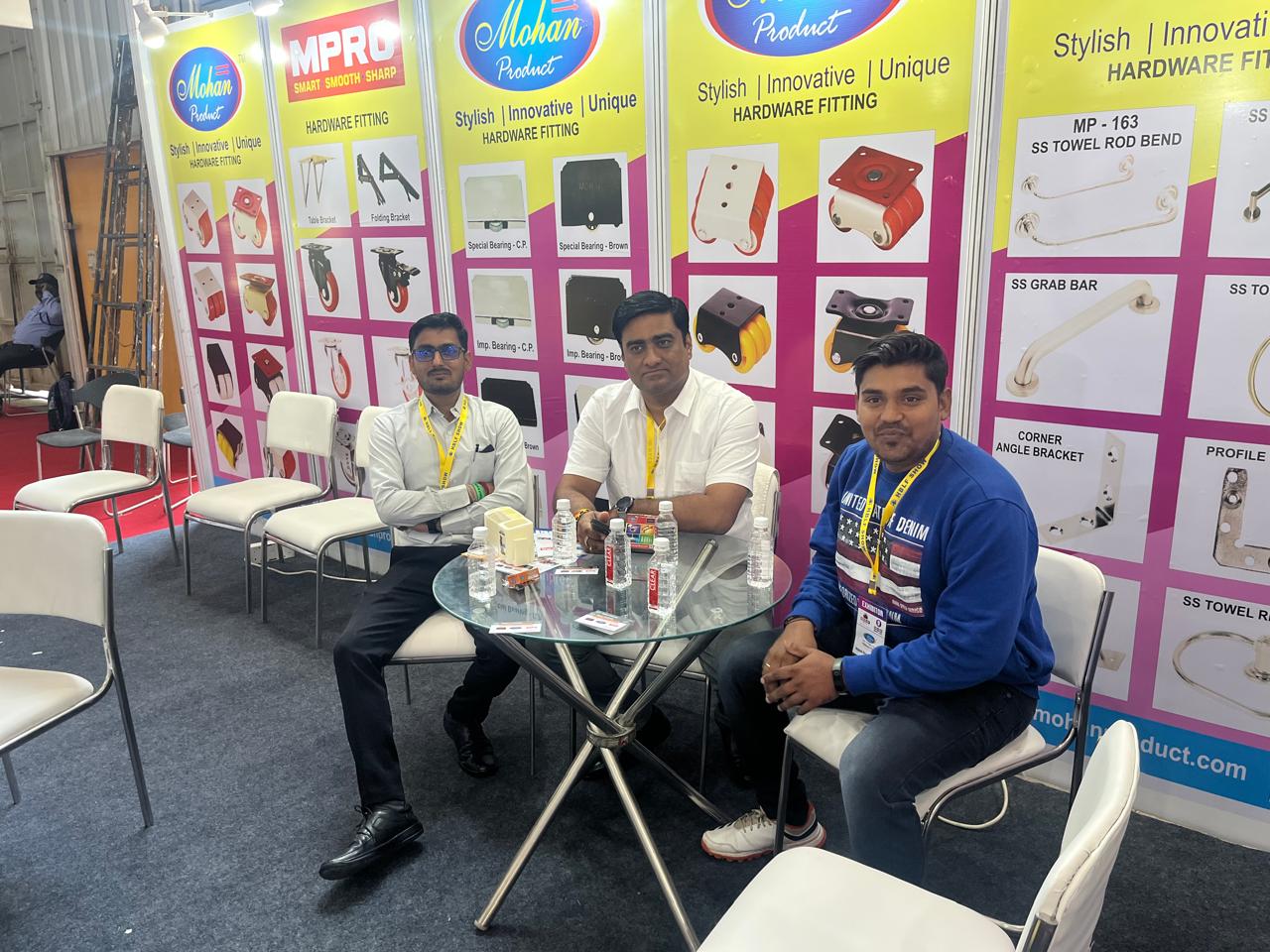 Mohan Product team seated with buyers at the exhibition stall